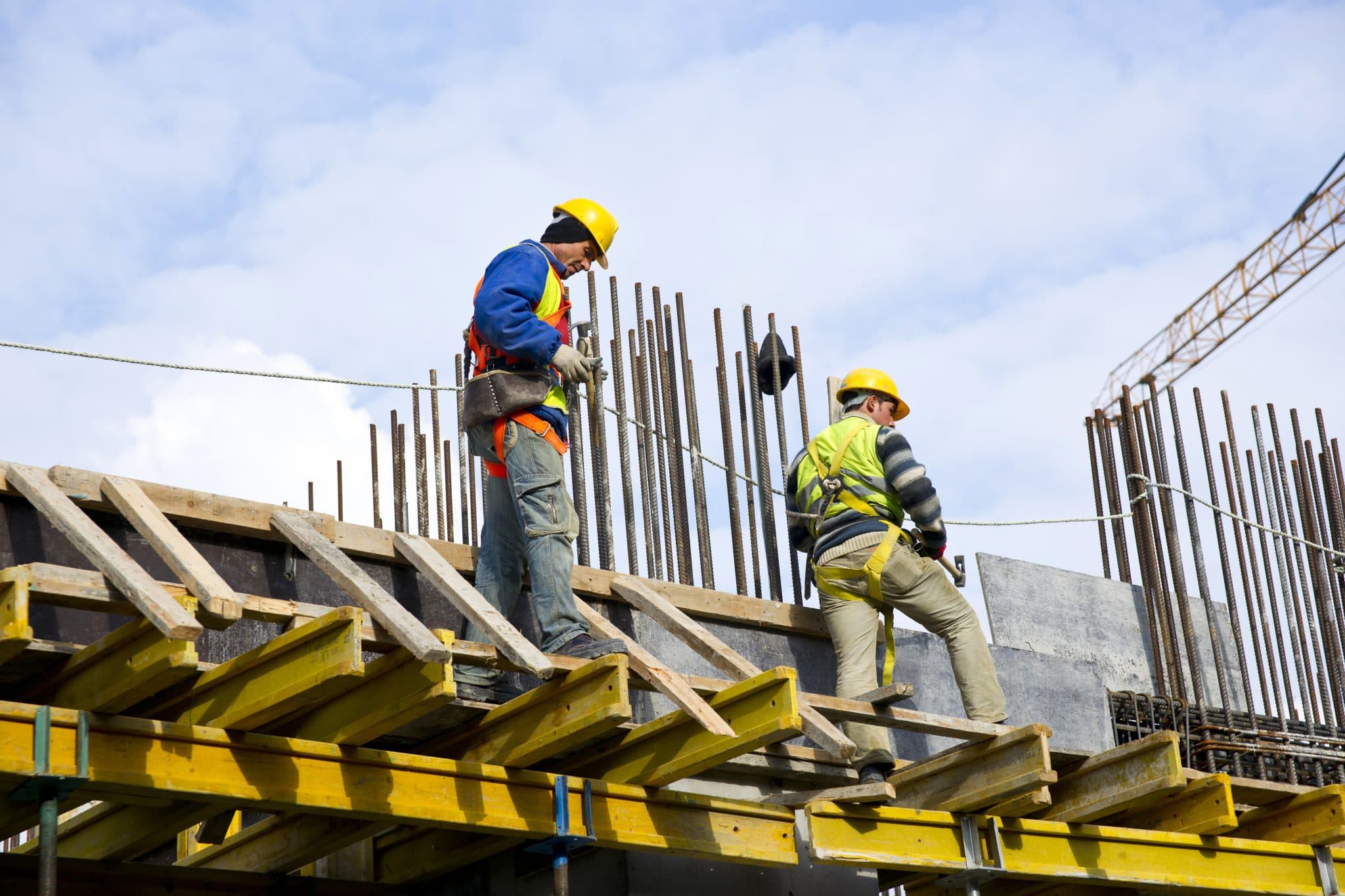 Construction worker with AI safety overlay showing real-time hazard detection
