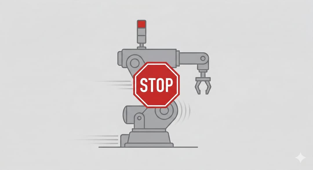 Industrial machine halted with safety indicator light showing red — hard-stop activated